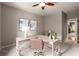 Office with large wooden desk, plush carpeting, natural light and views into the hallway at 1286 Whisper Cove Dr, Buford, GA 30518