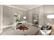 Stylish home office featuring panelled walls, modern decor, and ample natural light at 1286 Whisper Cove Dr, Buford, GA 30518