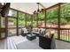 Spacious screened-in porch offers comfortable seating, perfect for outdoor entertainment at 1286 Whisper Cove Dr, Buford, GA 30518