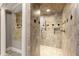Elegant tile shower with decorative accents, offering a luxurious bathing experience at 1286 Whisper Cove Dr, Buford, GA 30518