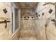 Luxurious walk-in shower with rainfall shower head and bench seating at 1286 Whisper Cove Dr, Buford, GA 30518