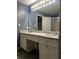 Bathroom featuring double sink vanity, granite countertops, and updated fixtures at 159 Parkside Dr, Stockbridge, GA 30281