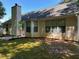 Back view of home with window details and yard at 159 Parkside Dr, Stockbridge, GA 30281