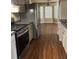 Kitchen features stainless steel appliances, granite countertops and a breakfast nook at 159 Parkside Dr, Stockbridge, GA 30281