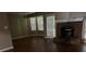 Bright living room featuring a fireplace and hardwood floors at 159 Parkside Dr, Stockbridge, GA 30281