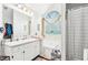 Serene bathroom featuring a soaking tub, shower, and spacious vanity area with neutral tones and soft lighting at 179 Parkside Dr, Stockbridge, GA 30281