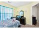 Cozy bedroom featuring a comfortable bed, dresser, and personal touches for a serene and inviting atmosphere at 179 Parkside Dr, Stockbridge, GA 30281