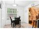 Charming breakfast nook with a table set for two, brightened by a window view and enhanced by neutral decor at 179 Parkside Dr, Stockbridge, GA 30281