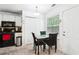 Cozy breakfast nook featuring a table, storage, and window views, complemented by kitchen appliances in background at 179 Parkside Dr, Stockbridge, GA 30281