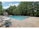 Community pool featuring many chairs, tables, and lounge chairs at 179 Parkside Dr, Stockbridge, GA 30281