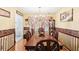 Elegant dining room with a large wooden table, chandelier, and decorative accents at 179 Parkside Dr, Stockbridge, GA 30281