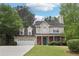 Charming two-story home featuring a well-manicured front yard and a brick-accented facade at 179 Parkside Dr, Stockbridge, GA 30281