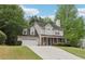 Charming two-story home featuring a well-manicured front yard and a brick-accented facade at 179 Parkside Dr, Stockbridge, GA 30281