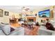Cozy living room featuring hardwood floors, fireplace, and comfortable seating at 179 Parkside Dr, Stockbridge, GA 30281