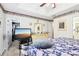 Spacious main bedroom with modern TV setup, dresser, and closet access for convenience and ample storage at 179 Parkside Dr, Stockbridge, GA 30281