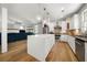 A gourmet kitchen offers a large island, stainless appliances, and an open view to the living room at 3278 Shakerley Park, Douglasville, GA 30135