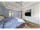 Spacious main bedroom with wood floors, large windows, custom built in cabinets and trey ceiling and plenty of natural light at 3278 Shakerley Park, Douglasville, GA 30135