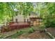 Spacious backyard featuring a tiered deck and lush greenery at 3627 Pebble Hill Ne Dr, Marietta, GA 30062