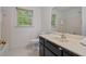 The bathroom features a dark vanity and a large, framed mirror at 3627 Pebble Hill Ne Dr, Marietta, GA 30062