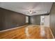 Sizeable bedroom featuring hardwood floors, a ceiling fan, and an ensuite bathroom at 3627 Pebble Hill Ne Dr, Marietta, GA 30062