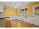 Eat-in kitchen with hardwood floors and a large window overlooking the backyard at 3627 Pebble Hill Ne Dr, Marietta, GA 30062
