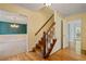 Inviting foyer with hardwood floors, a staircase, and a glimpse into the dining and living areas at 3627 Pebble Hill Ne Dr, Marietta, GA 30062