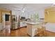 Well-lit kitchen features stainless steel appliances and cozy breakfast bar at 3627 Pebble Hill Ne Dr, Marietta, GA 30062