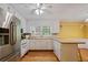 Bright kitchen features white cabinets, stainless steel appliances, and hardwood floors at 3627 Pebble Hill Ne Dr, Marietta, GA 30062