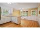 Bright eat-in kitchen has wood floors, ample cabinets, and lots of sunlight at 3627 Pebble Hill Ne Dr, Marietta, GA 30062