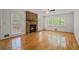 Spacious living room with a stone fireplace and warm, wood flooring at 3627 Pebble Hill Ne Dr, Marietta, GA 30062