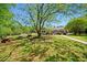 Well-maintained lawn with picnic tables and a covered patio area, ideal for outdoor entertaining and relaxation at 3627 Pebble Hill Ne Dr, Marietta, GA 30062