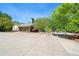 Community clubhouse featuring a parking lot, landscaped grounds, and partial view of a pool, enhancing community lifestyle at 3627 Pebble Hill Ne Dr, Marietta, GA 30062