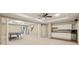 Spacious basement area with tile and carpet flooring, large entertainment area, bar, and storage at 470 W Magnolia Cir, Johns Creek, GA 30005