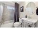 Well-lit bathroom features a tub, a stylish sink, and modern fixtures at 470 W Magnolia Cir, Johns Creek, GA 30005