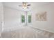Bright bedroom with plush carpet, neutral walls, and natural light at 470 W Magnolia Cir, Johns Creek, GA 30005