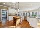 Well-equipped kitchen featuring a center island, granite countertops, and modern appliances, designed for culinary enthusiasts at 470 W Magnolia Cir, Johns Creek, GA 30005