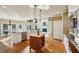 Gourmet kitchen featuring an island, stainless steel appliances, and hardwood floors, blending functionality and style at 470 W Magnolia Cir, Johns Creek, GA 30005