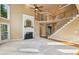 Spacious living room with a fireplace and a staircase, offering a comfortable and stylish gathering space at 470 W Magnolia Cir, Johns Creek, GA 30005