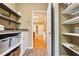 Walk-in pantry with plentiful shelving and custom organization at 470 W Magnolia Cir, Johns Creek, GA 30005