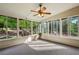 Cozy sunroom filled with natural light, perfect for relaxation and enjoying views of the landscaped backyard at 470 W Magnolia Cir, Johns Creek, GA 30005
