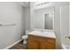Bright bathroom featuring a vanity, mirror, and updated lighting at 7712 Autry Circle # 204, Douglasville, GA 30134