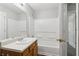 Spacious bathroom featuring a vanity, mirror, shower and tub combo at 7712 Autry Circle # 204, Douglasville, GA 30134