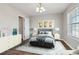 Well-lit bedroom with neutral paint, stylish decor, and a large window for natural light at 7712 Autry Circle # 204, Douglasville, GA 30134