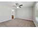 Bedroom with carpet and a ceiling fan with an adjoining bathroom at 7712 Autry Circle # 204, Douglasville, GA 30134