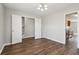 Bright dining area featuring hardwood floors and an open layout connected to the kitchen and stairs at 7712 Autry Circle # 204, Douglasville, GA 30134