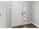 Entryway with a white door, sidelight, and wood-look floors, creating a bright and inviting foyer at 7712 Autry Circle # 204, Douglasville, GA 30134
