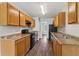 Open kitchen offering wooden cabinets, black appliances, and plenty of countertop space at 7712 Autry Circle # 204, Douglasville, GA 30134