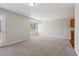 Spacious living room featuring neutral walls and carpet, offering a blank canvas for personalized decor and comfort at 7712 Autry Circle # 204, Douglasville, GA 30134