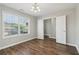 Neutral room with hardwood floors and lots of natural light looking out onto the neighborhood at 7712 Autry Circle # 204, Douglasville, GA 30134