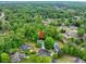 Aerial view of a home nestled within a lush, green neighborhood, marked by a red location pin at 2262 Silver Fox Ln, Buford, GA 30519